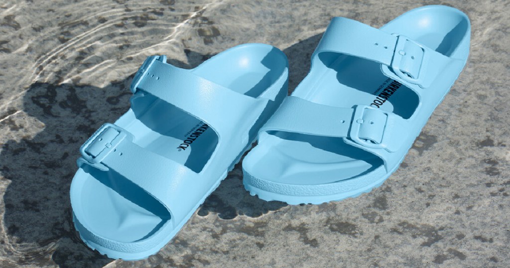 Blue Birkenstocks sitting in water