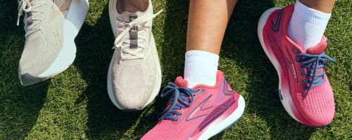Man and woman's feet wearing Brooks Glycerin running shoes