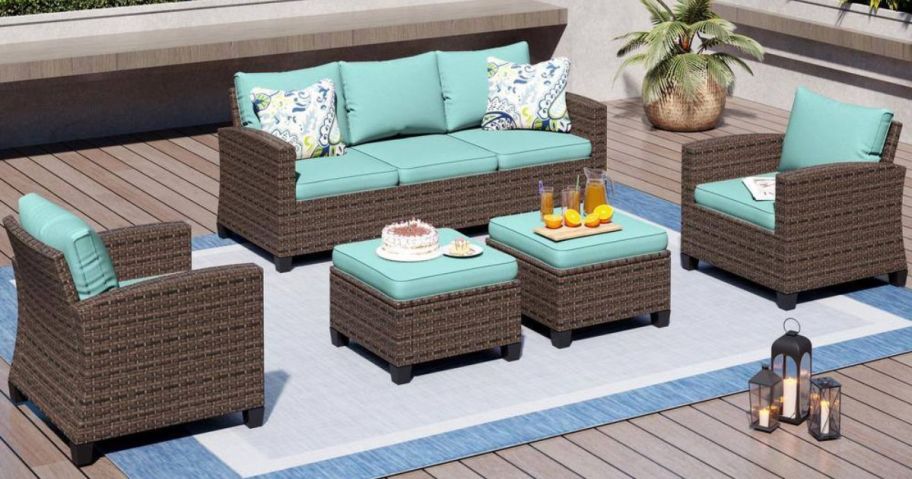 A brown rattan wicker sectional on a deck