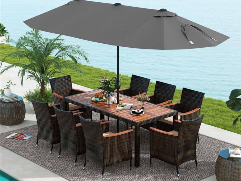 An outdoor dining table with an umbrella 