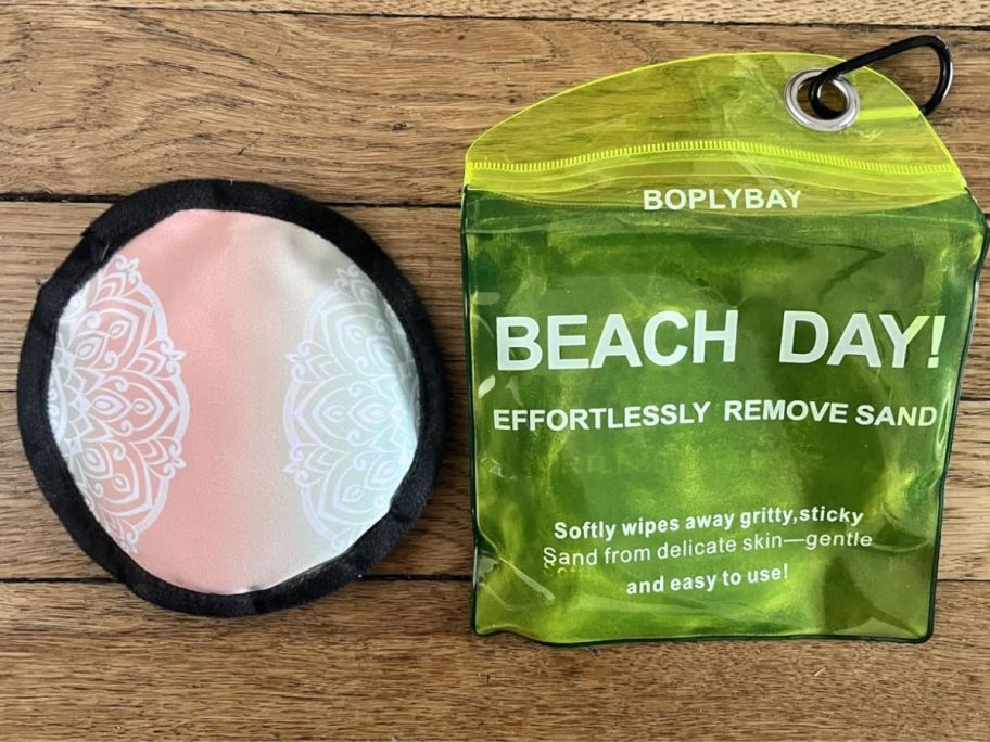 A pastel circular sand removing pad with case