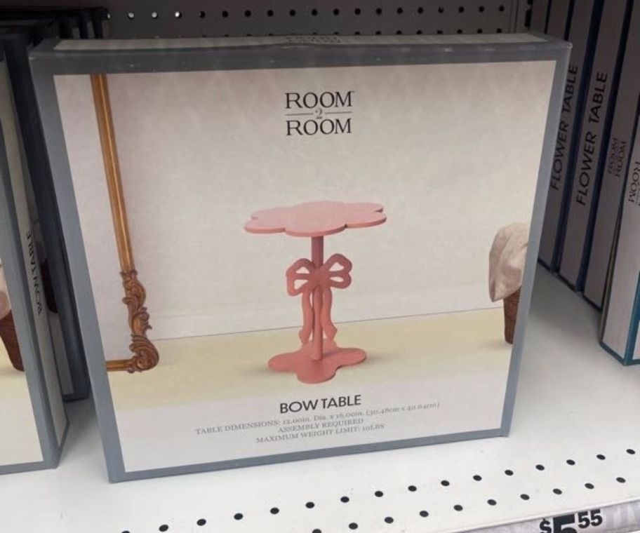 A box featuring a small pink table