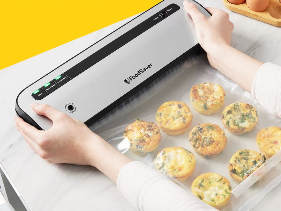 woman sealing egg bites in a FoodSaver