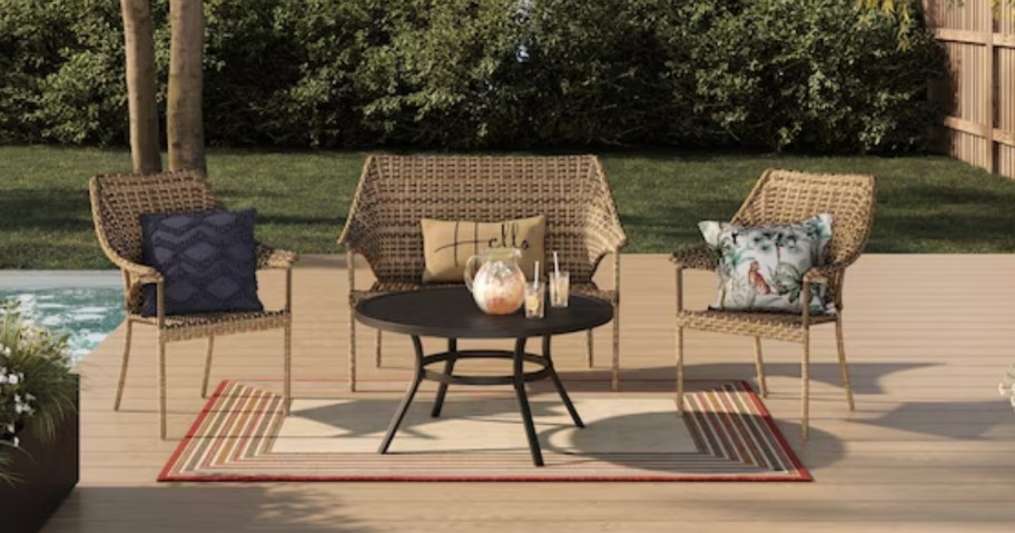 wicker loveseat and chairs on a back patio