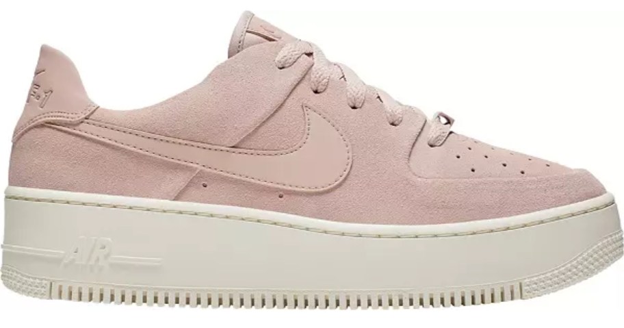 a women's pink and white Nike shoe