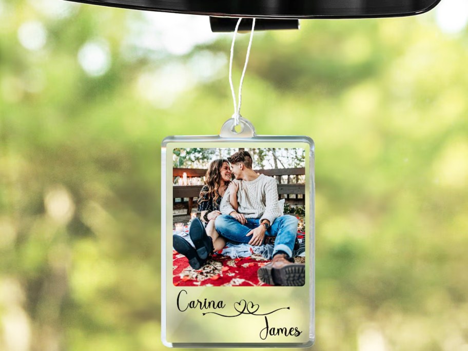 personalized photo frame hanging from rear view mirror in car