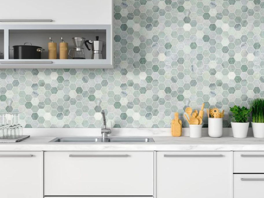 A kitchen with MSI Icelandic Green 2" Hexagon Polished Marble 12x12 Mosaic Tile