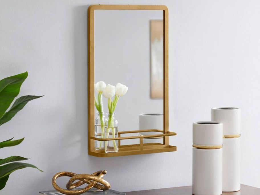 Home Decorators Collection Modern Mirror w/ Shelf hung on a wall over a dresser