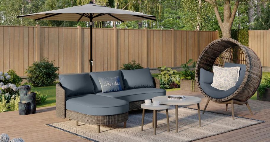 A patio with a Origin 21 Dunes Wicker Patio Sofa 3-Piece Conversation Set on it