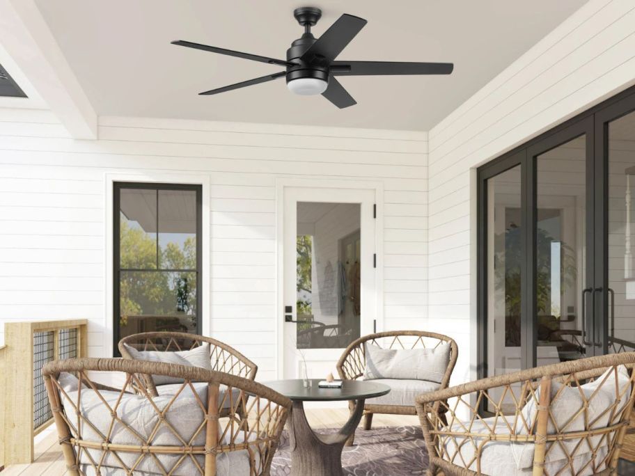 Celing over a patio set with a Harbor Breeze Flanagan III Color-Changing LED Indoor/Outdoor Ceiling Fan on it