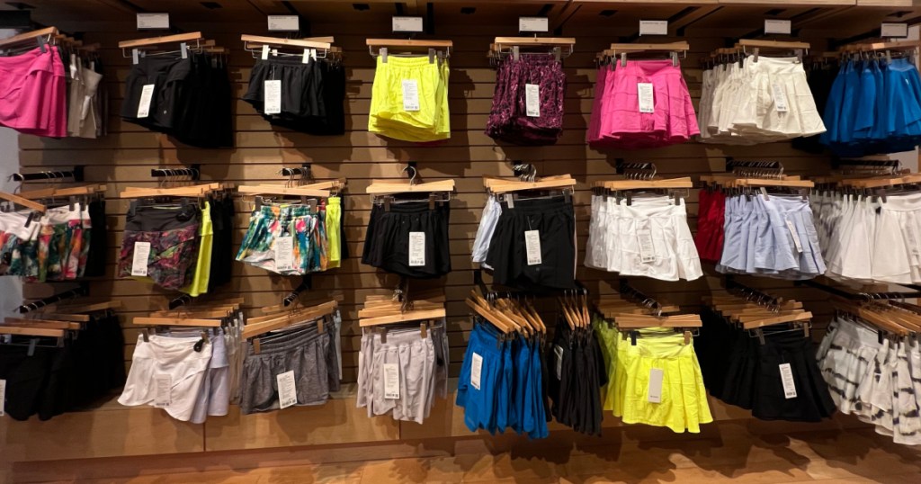 Different colors of Lululemon shorts and skirts on display inside store