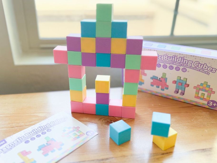 An Apluses Magnetic Blocks Set with a tower built with the blocks