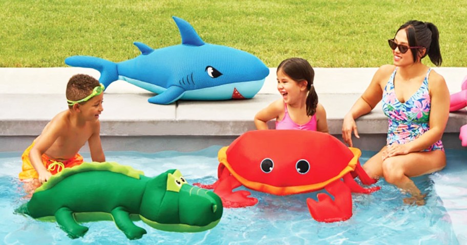 kids and mom in pool with mesh animal toys