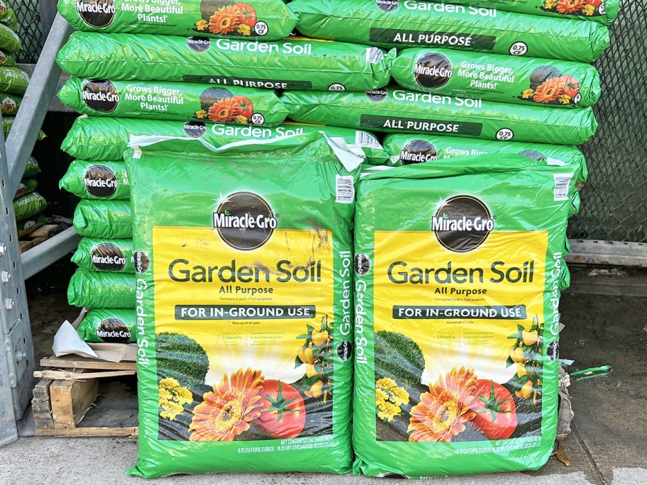 green and yellow bags of Miracle-Gro 0.75-cu. ft.In-Ground Soil