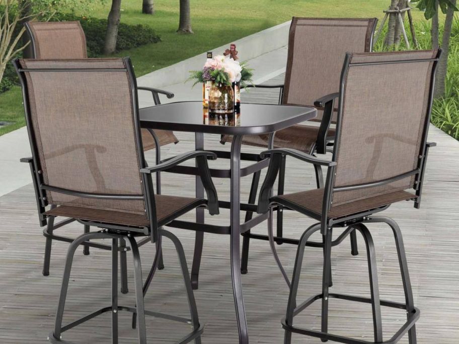 A brown high seat patio bar set