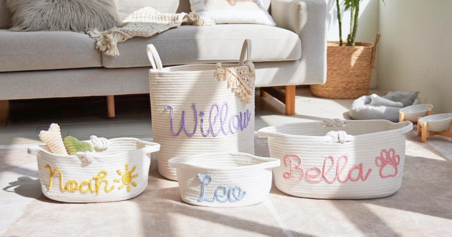 4 personalized baskets on living room floor