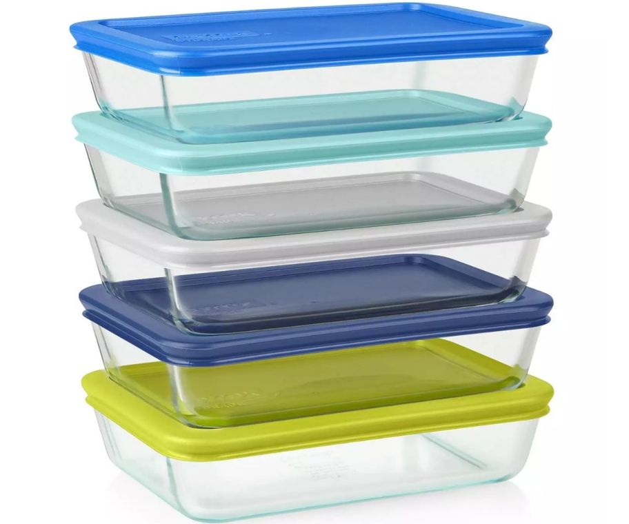 a stack of 5 rectangular glass food storage bowls with color coded lids