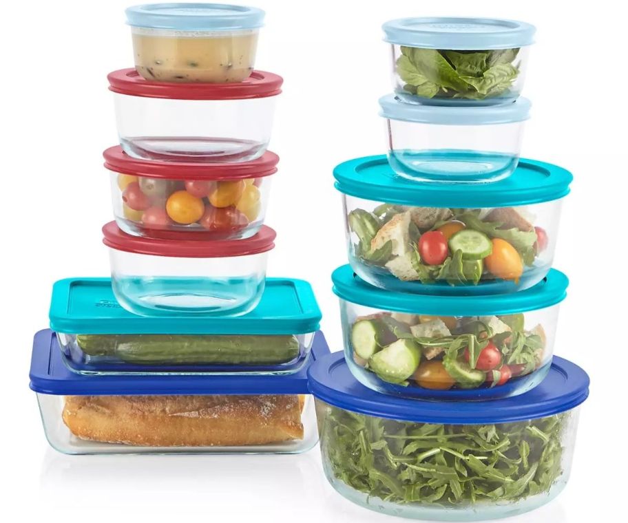 a 22 piece set of round and rectangular glass food storage bowls with color coded plastic lids
