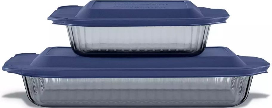 two blue tinted glass baking dishes with color coordinated plastic lids.