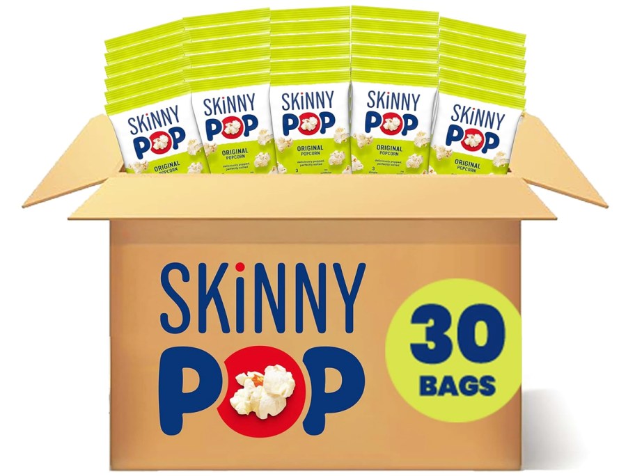 cardboard box filled with small bags of SkinnyPop popcorn