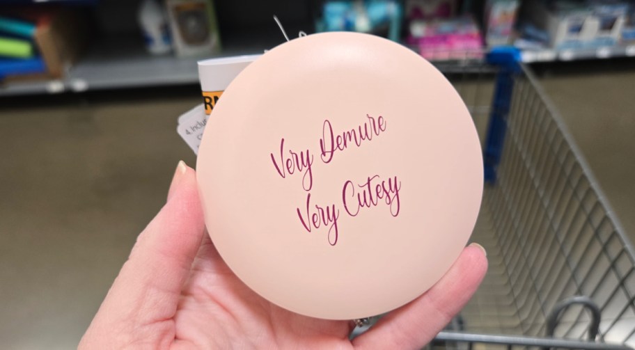 hand holding a Way to Celebrate Mother's Day Very Demure Pink Mini LED Makeup Mirror