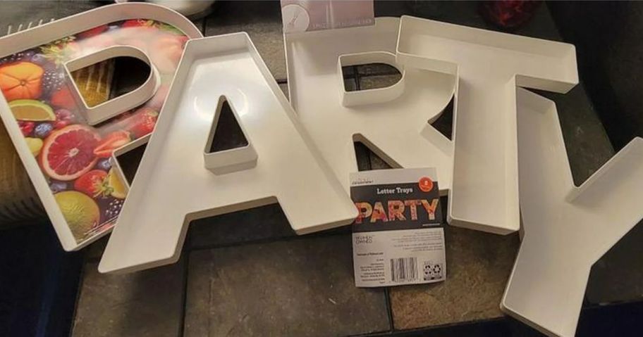 white plastic boxes in the shape of a letters that spell PARTY