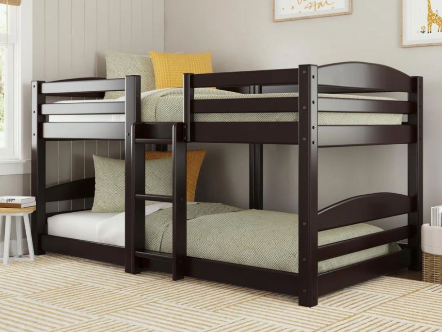 An espresso clor wood Harriet Bee Kamello Twin over Twin Floor Bunk Bed in a bedroom