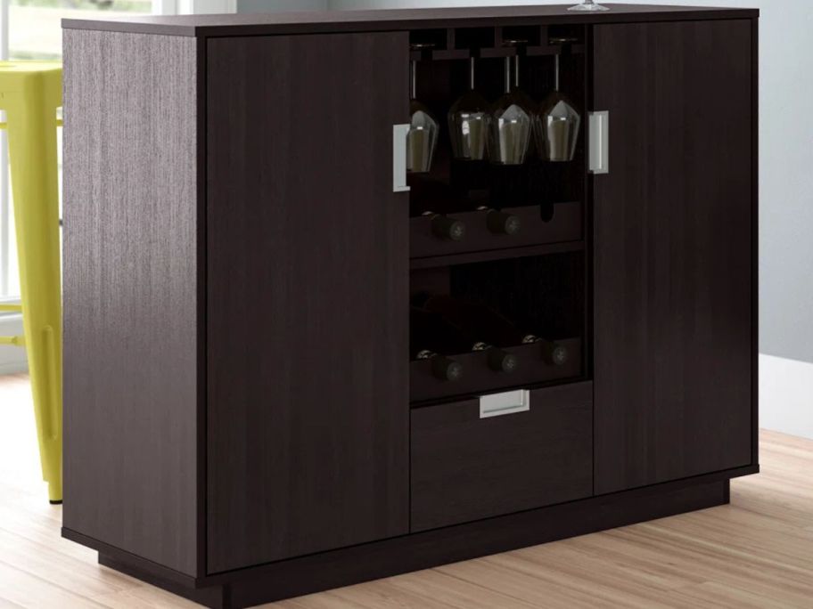 Zipcode Design Appomattox Bar Cabinet with wine glasses and bottles of wine stored in the compartments