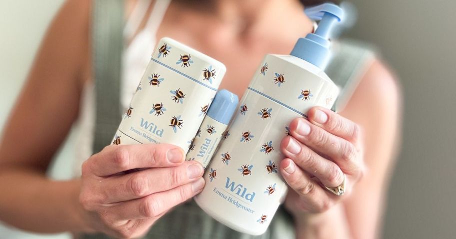 Woman holding a Wild Refillable Deodorant, Lip Balm and Lotion