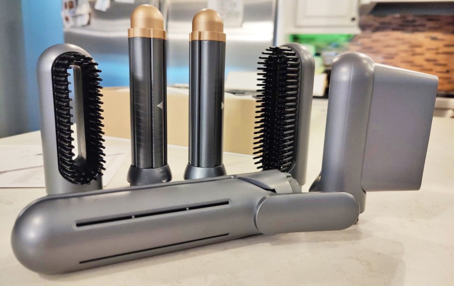 hair dryer brush attachments lined up on kitchen counter