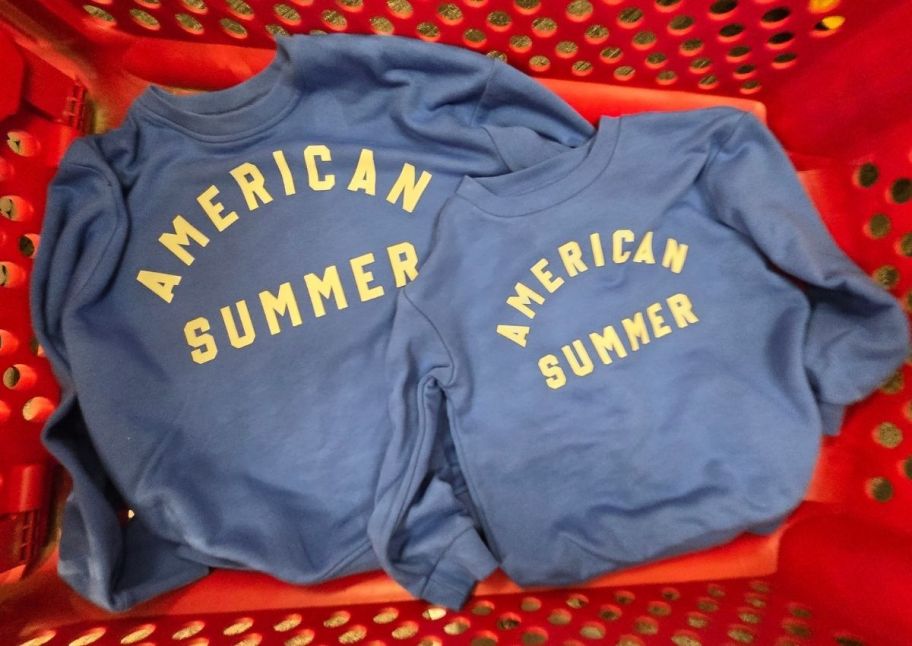 two blues crewneck sweatshirts in a target cart