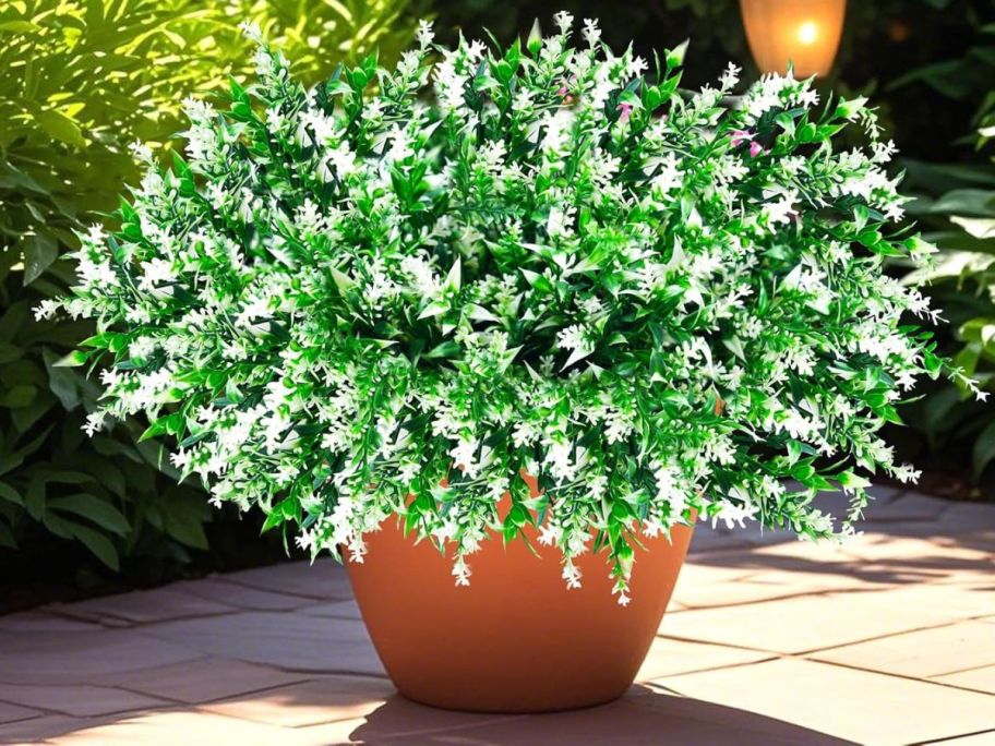 Artificial White Flowers in pot outside