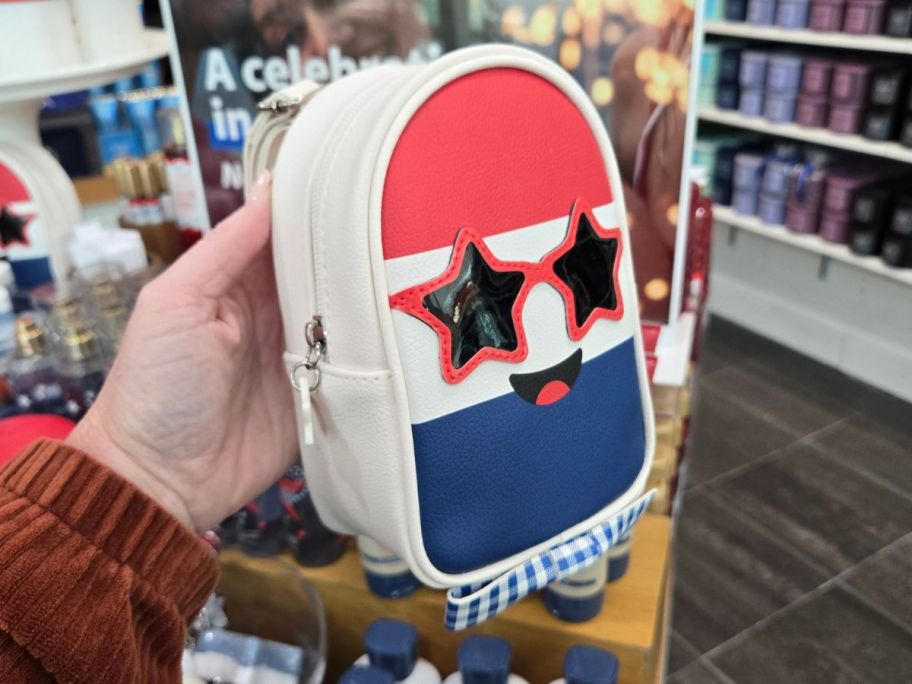 Bath & Body Works Firecracker Pop Mini Backpack in hand in store