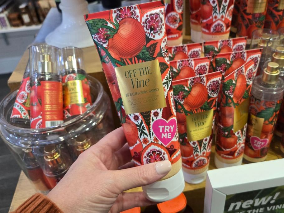 Bath & Body Works Off The Vine Body Cream in hand in store