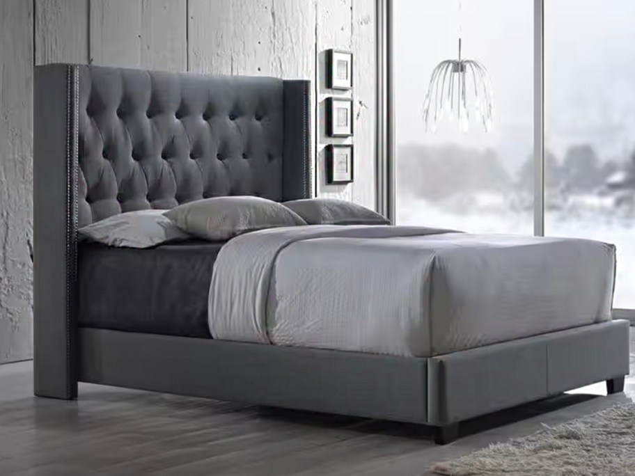 gray upholstered bed 