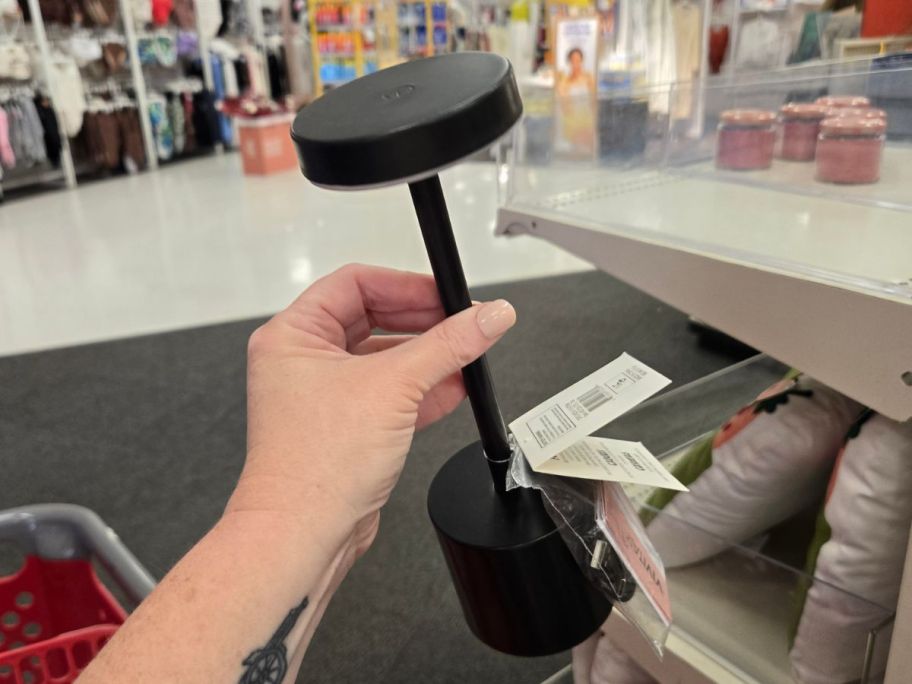 black Outdoor Table Lamp in hand in store