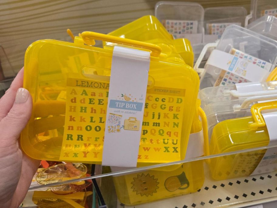 yellow tip box in hand in store