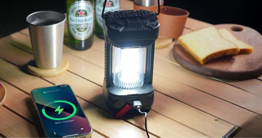 black camping lantern on picnic table