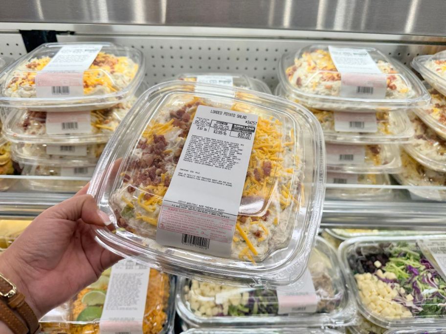 Loaded Potato Salad container in hand in store