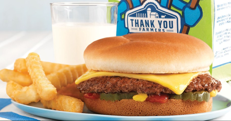 kids meal burger and crinkle fries next to milk