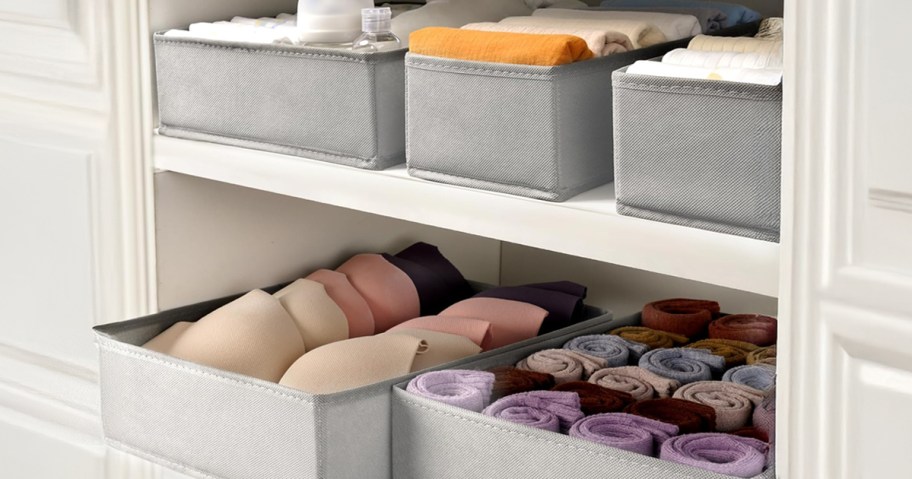 grey drawer organizer bins on a shelf