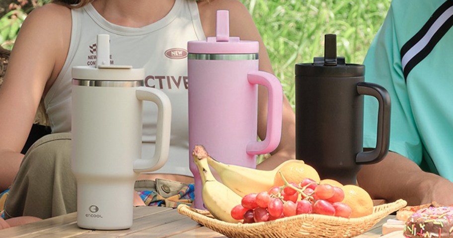 three tumblers sitting on a table outside