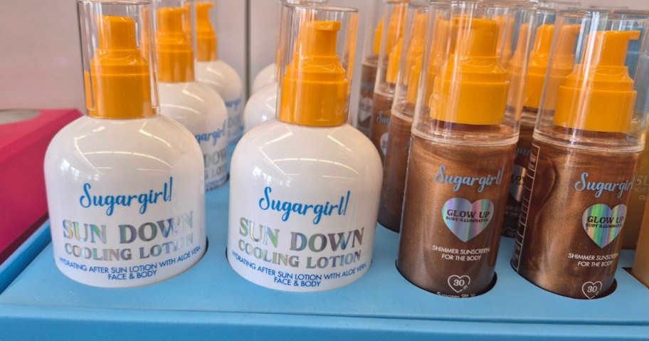 spray bottles of Sugargirl! brand lotion on display on a store shelf