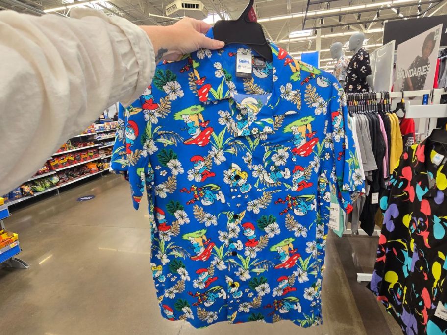 blue Smurfs Men's Hawaiian Shirt in hand in store