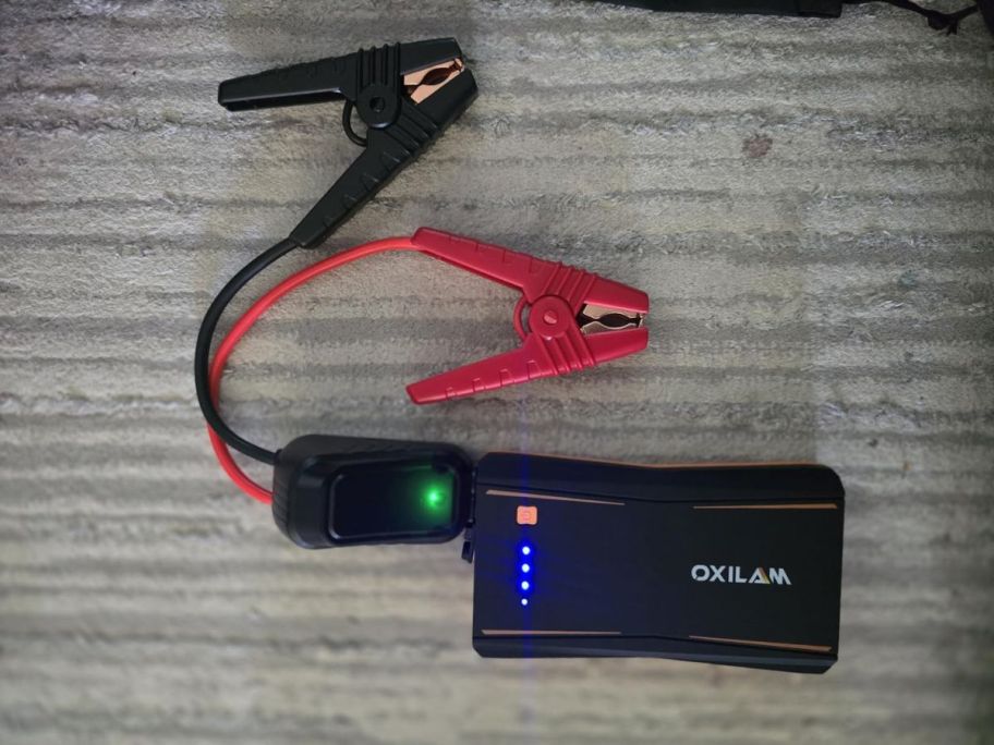 OXILAM Portable Jump Starter on table