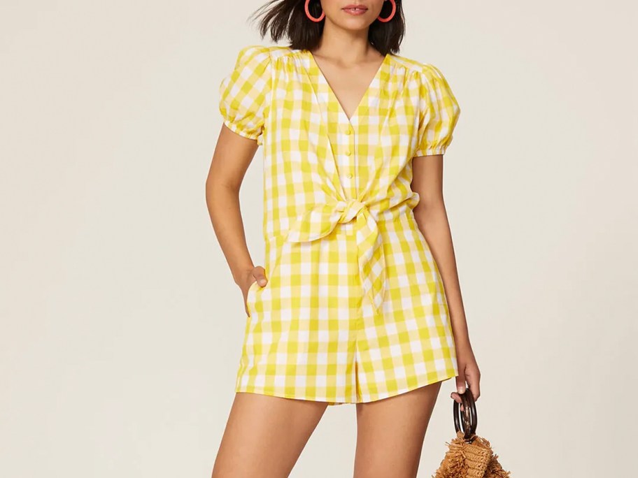 woman wearing yellow and white romper 