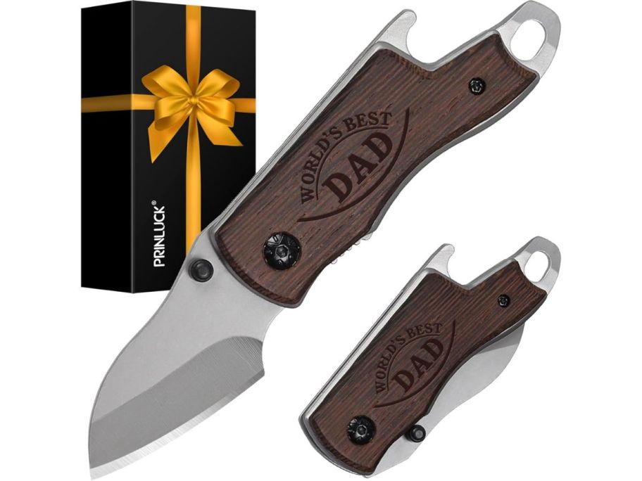 wood folding knife stock image with gift box in the background