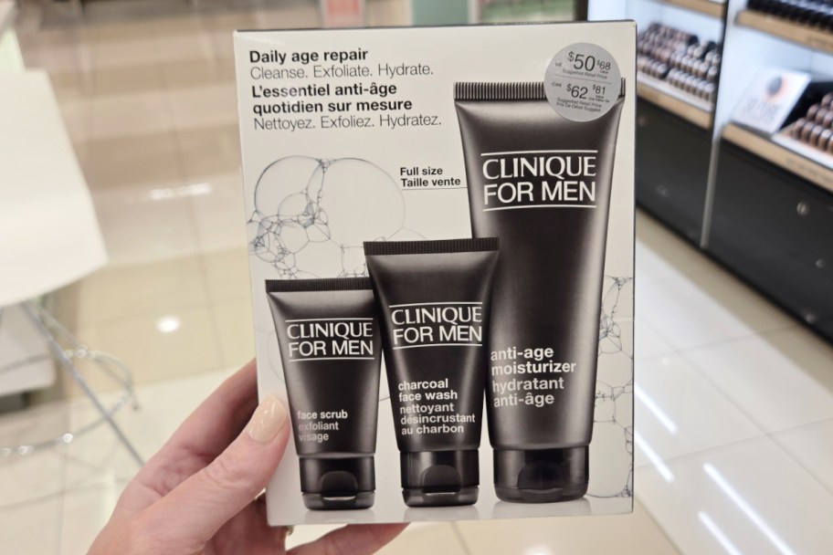 hand holding 3 piece skincare set