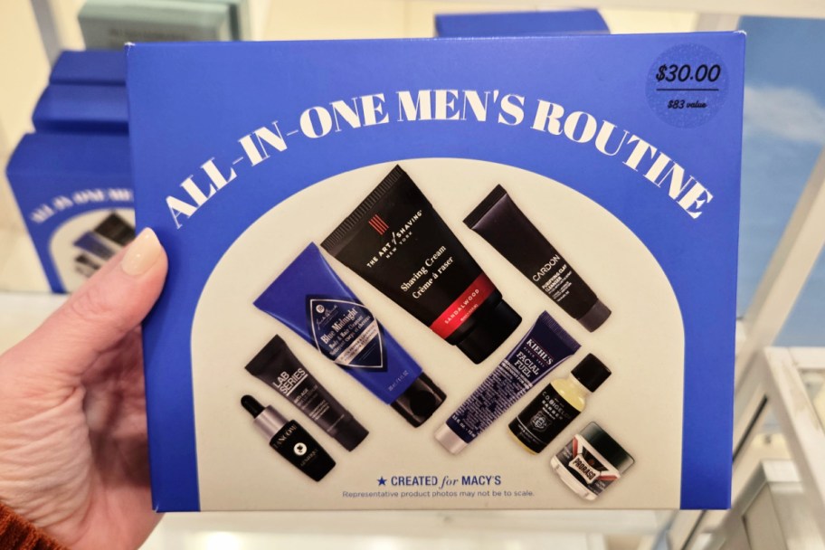 hand holding blue box of skincare