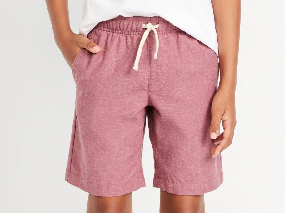 boy wearing pink shorts